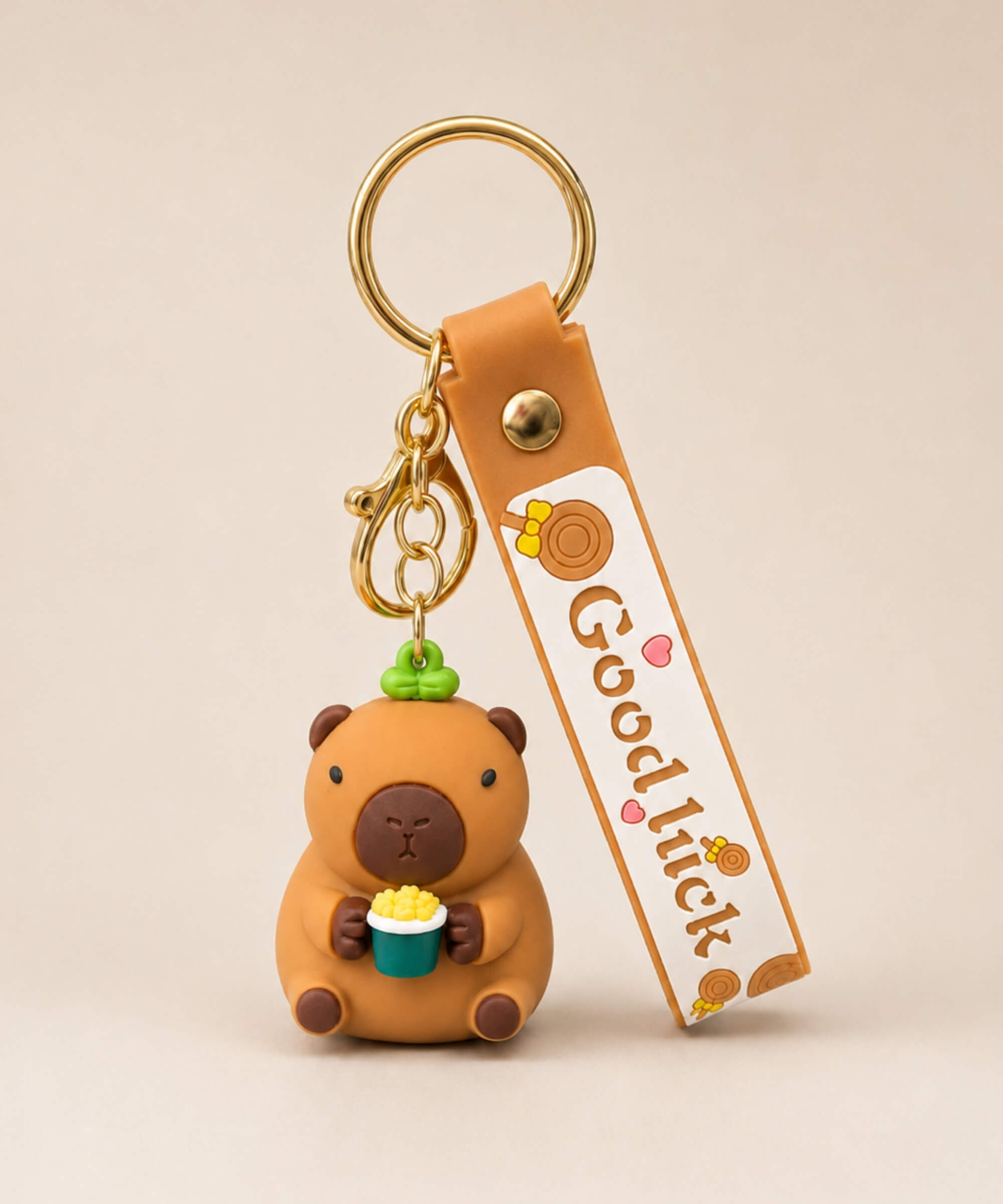Capybara popcorn classic keychain with brown strap, gold hardware and cute character bag charm